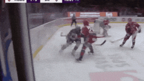 a hockey game is being played in front of a sign that says pepsi