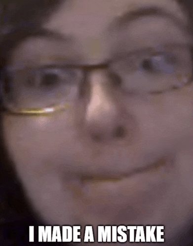 a close up of a person 's face with the words i made a mistake above it