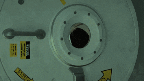 a cartoon character in a space suit is looking through a window