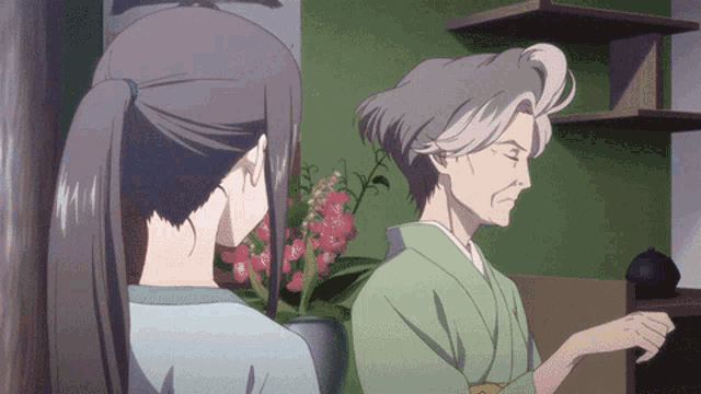 a woman in a ponytail stands next to an older woman