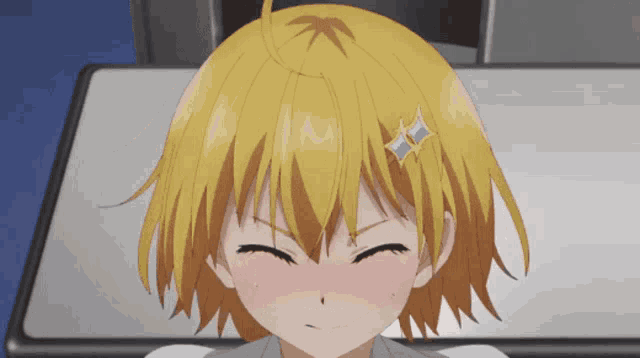 a close up of a girl with yellow hair making a funny face