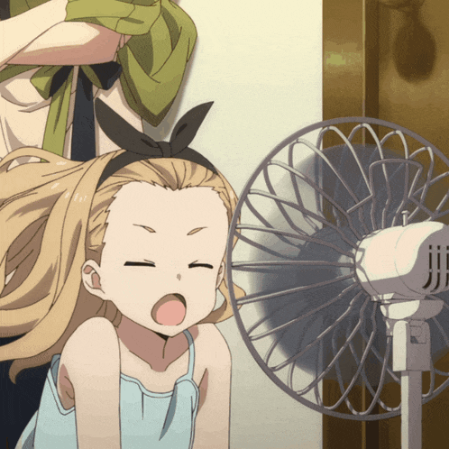 a girl with a bow on her head is looking at a fan