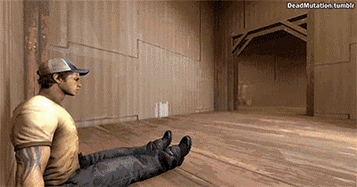 a man is sitting on the floor in an empty room with his legs crossed .
