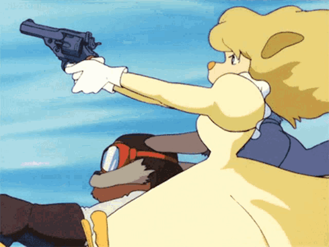 a woman in a yellow dress is pointing a gun at someone