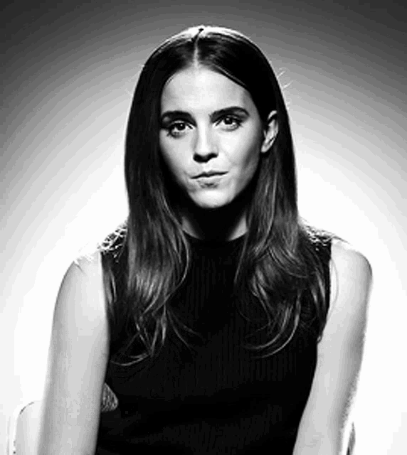 a woman with long hair is making a funny face in a black and white photo
