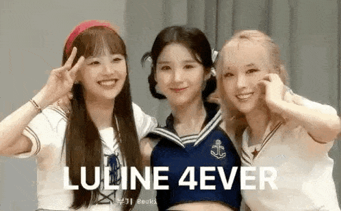 a group of three girls are posing for a picture together .