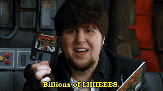 a man holding a floppy disk that says indiana jones