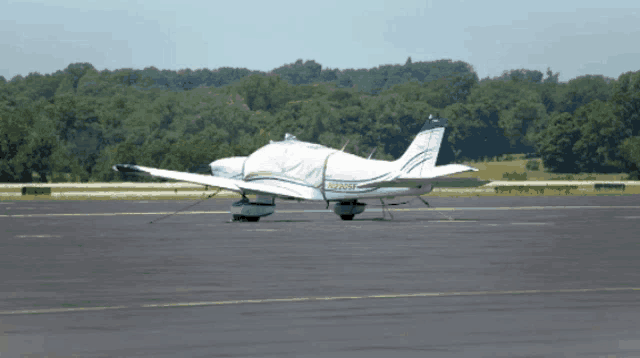 a small airplane with the letters n25nw on the tail
