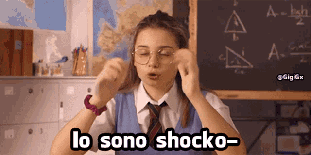a girl wearing glasses and a tie says lo sono shocko-