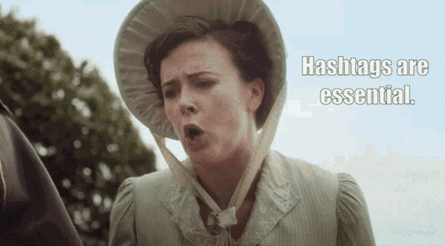 a woman wearing a hat with the words " hashtags are essential " below her