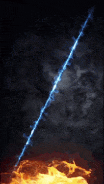 a blue beam of light is coming out of the ground