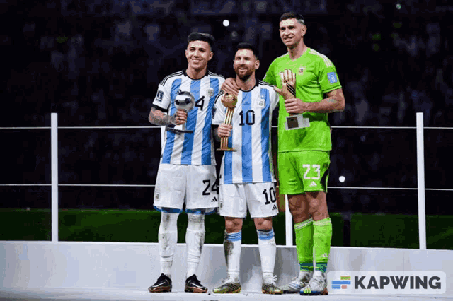 three soccer players are posing for a photo and one has the number 10 on his shirt