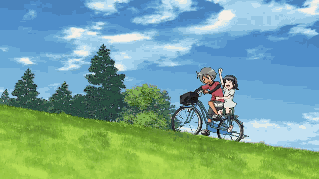 a boy and a girl are riding a bicycle on a grassy hill