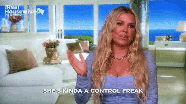 a woman says she 's kinda a control freak while standing in a living room