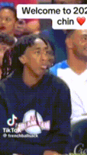 a man sitting in a crowd with a welcome to 202 chin speech bubble above him
