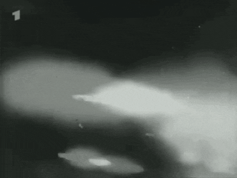 a black and white photo of a fire with the number 1 in the upper right corner