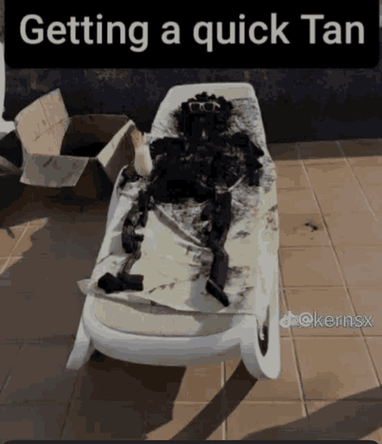 a picture of a person laying on a lounge chair with the caption " getting a quick tan "