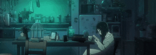 a woman is laying on a table with a cup of coffee on it .
