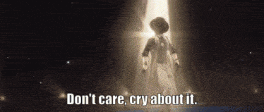 a man in a suit and hat is standing in front of a light with the words " don t care cry about it " below him