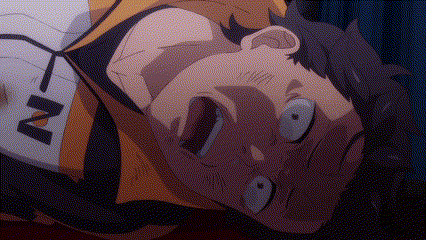 a man is laying on his back with his mouth open and a n on his shirt .