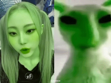 a woman with green hair is next to a picture of a cat with green eyes