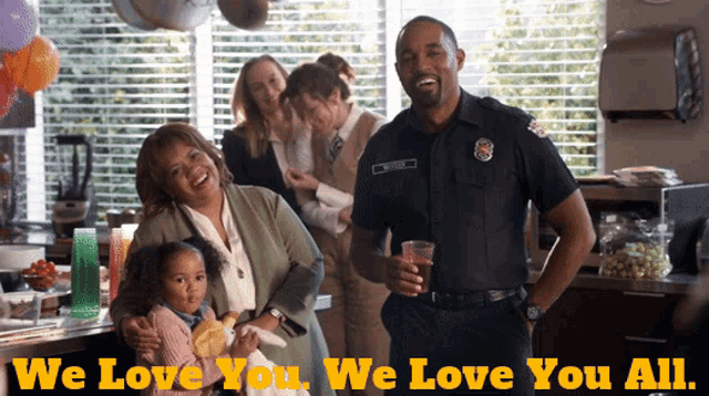 a group of people posing for a picture with the words " we love you we love you all " on the bottom