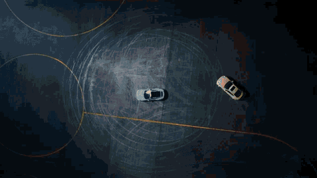 a yellow car is driving down a road