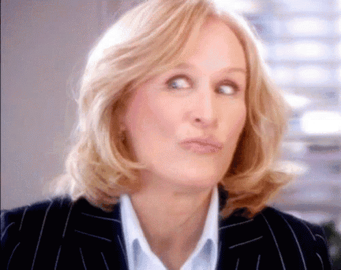 a close up of a woman making a face