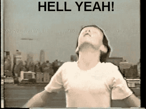 a man in a white shirt is standing in front of a city skyline with the words hell yeah written above him