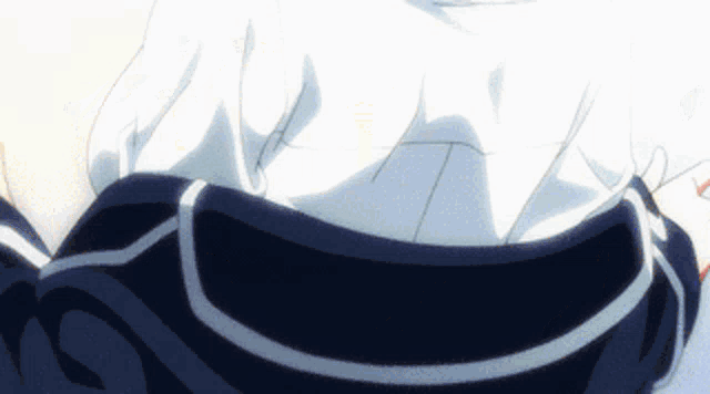a close up of a person 's back with a white shirt and black skirt
