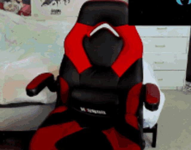 a black and red gaming chair with the word x-series on the back