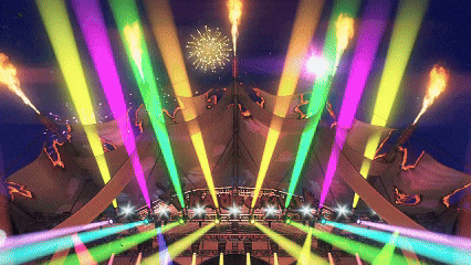 a large tent with a lot of lights and fireworks going off