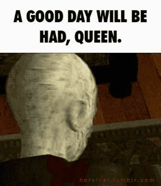 a statue of a man 's head with the words `` a good day will be had , queen '' written on it .