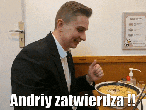 a man in a suit is standing next to a bowl of food with the words andriy zatwierza written on the bottom