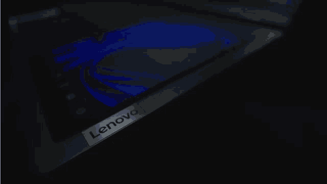 a lenovo tablet is shown in the dark with the words one tool above it