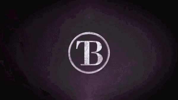 a close up of a purple metal surface with a purple background .