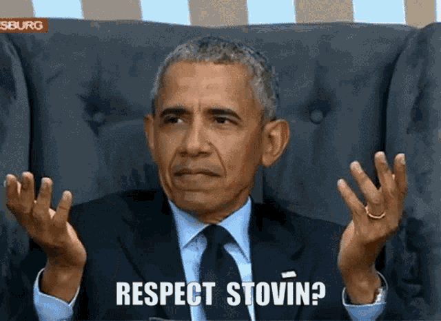 a man in a suit and tie is sitting in a chair and says respect stovin