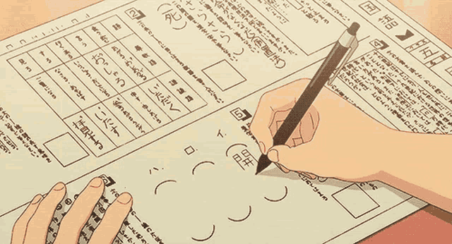 a person is writing on a piece of paper with chinese characters