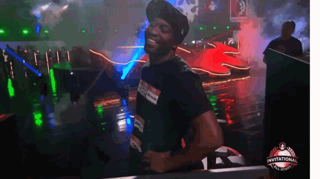 a man wearing a black shirt that says invitational
