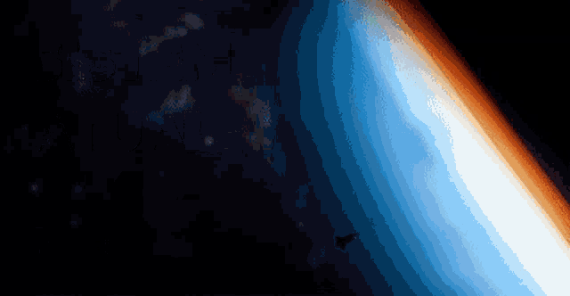 a silhouette of a rocket flying over a blue planet