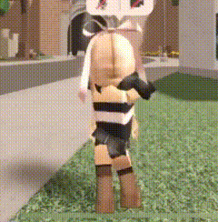 a doll is standing on a lush green lawn in a room .