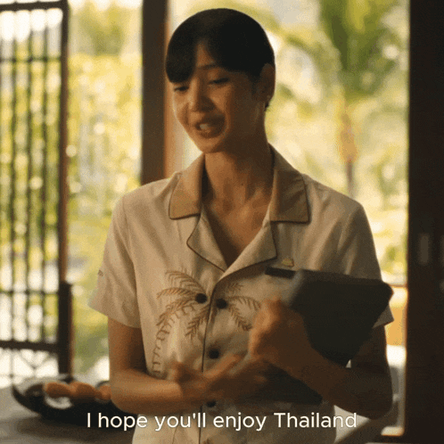 a woman is holding a tablet and says i hope you 'll enjoy thailand on the bottom