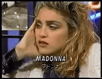 a close up of a woman 's face with the name madonna written on it