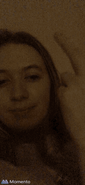 a girl is giving the middle finger and the momento logo is visible in the corner