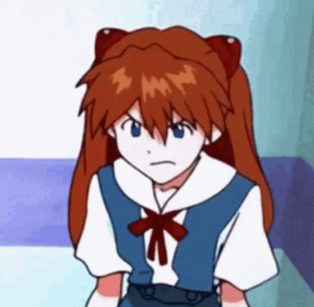 a cartoon girl with red hair and blue eyes is sitting on a bed and making an angry face .