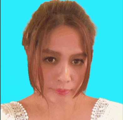 a close up of a woman 's face against a blue backdrop