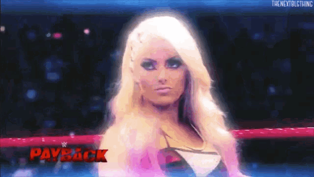 a woman in a wrestling ring with payback written on the bottom