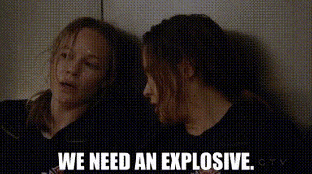 two women are sitting next to each other and talking .