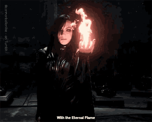 a man holding a torch with the words with the eternal flame written below him