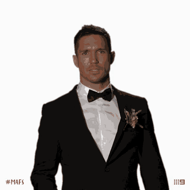 a man in a tuxedo with a flower in his lapel says # mafs